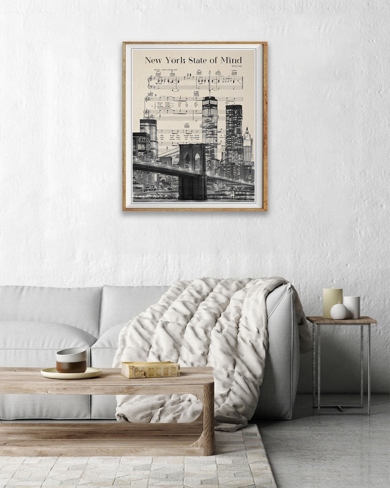 May include: Black and white photo of the New York City skyline at night with the Brooklyn Bridge in the foreground. The image is overlaid with sheet music for the song "New York State of Mind" by Billy Joel.