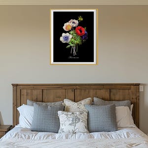 May include: A framed botanical print of a bouquet of white, red, and blue anemones on a black background. The print is titled "Anemone".