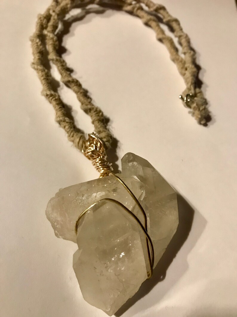 Double Crystal Tips wrapped in gold wire and attached to an 24\u201d all Natural Hemp woven necklace
