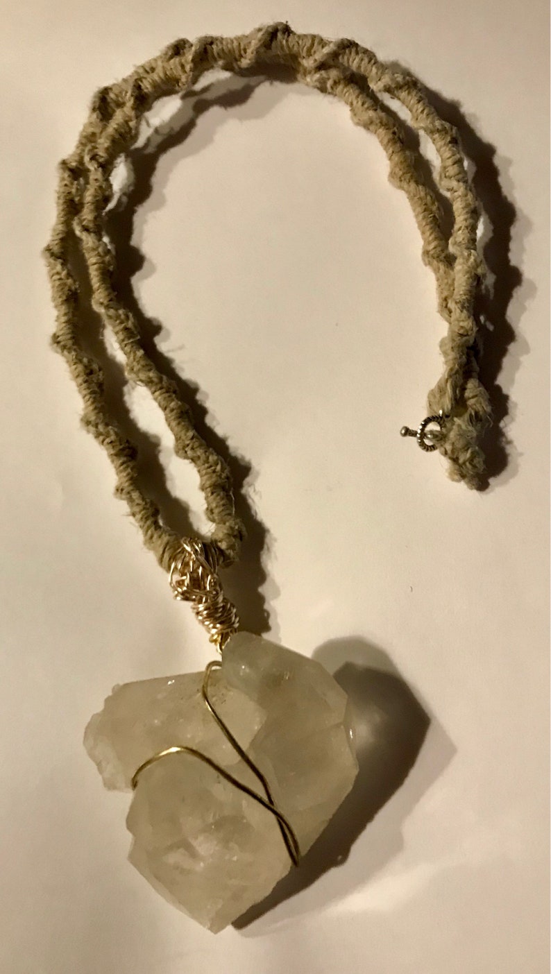 Double Crystal Tips wrapped in gold wire and attached to an 24\u201d all Natural Hemp woven necklace
