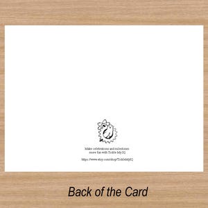 May include: The back of a white card with black text that reads "Make celebrations and milestones more fun with Tickle My IQ" and a website address. The card has a small black and white illustration of a cartoon character.