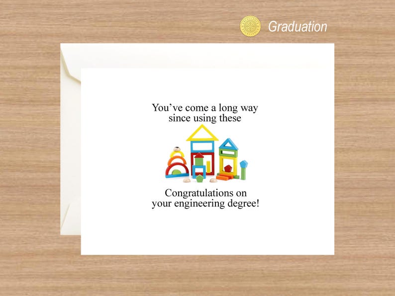 May include: A graduation card with a humorous message about building blocks and an engineering degree. The card features a colorful illustration of wooden building blocks arranged to look like houses.