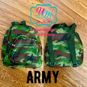 May include: A small green and brown camouflage backpack with adjustable straps. The backpack has a zippered pocket on the front. The text "ARMY" is printed below the backpack.