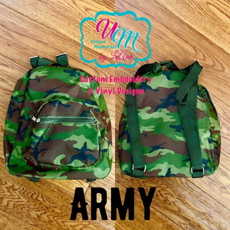 May include: A small green and brown camouflage backpack with adjustable straps. The backpack has a zippered pocket on the front. The text "ARMY" is printed below the backpack.