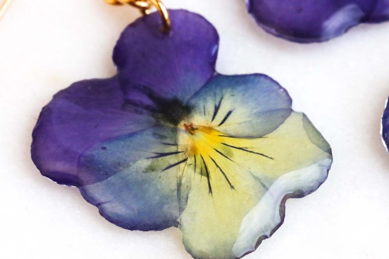 Real pressed pansy flower used in botanical jewelry