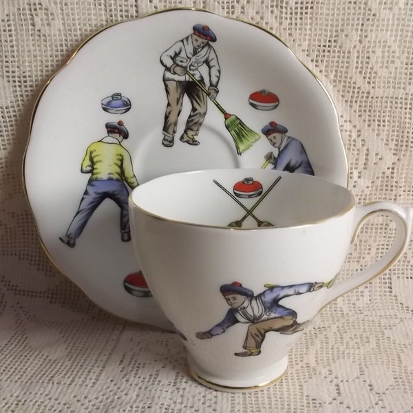 Unique curling tea cup and saucer by Royal Standard china, handpainted, curlers in tartan tams, bonspiel play, collectable
