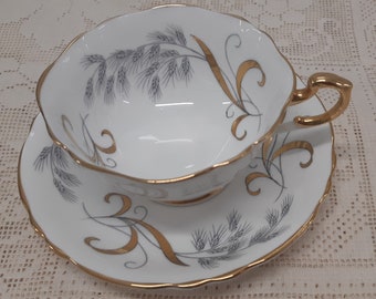 Paragon black and gold on white tea duo - elegant gold lustre pattern with grain design and gold ochre ribbon flourishes, Paragon tea cup