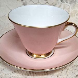 Light Quartz pink Royal Doulton china teacup and saucer are elegantly simple with gold edges in lustre and a gold luster foot. English china