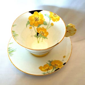 Discounted Paragon flower handled teacuo and saucer, Art Deco hand painted teacup and saucer, buttercups, highly collectable tea cup