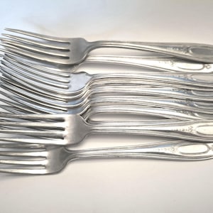 Eight  silver plated dinner forks, oval with beaded dot  pattern and stylized leaves, vintage forks, vintage cutlery