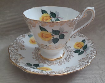 Royal Standard Yellow long stemmed Rose - tea duo - gold filigree designs  tea cup and saucer - shaded gold edges, friendship roses