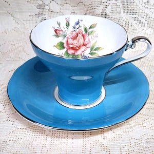 Lovely vintage turquoise Aynsley tea duo  with a cluster of pink tea roses inside, corset shaped teacup and saucer, 1934 back stamp