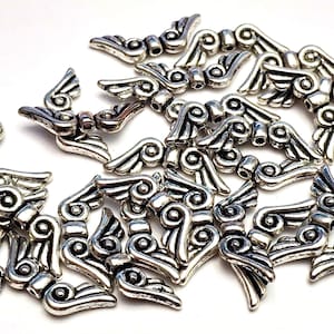 Metal angel wing beads,   new old stock, silver coloured metal wings for making mini beaded angels. choose the amount you want.