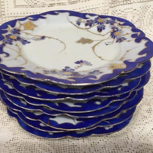 Exquisite set of four or eight Japanese antique dessert plates - Bold blues gold designs white porcelain - no chips no cracks, yet flaws