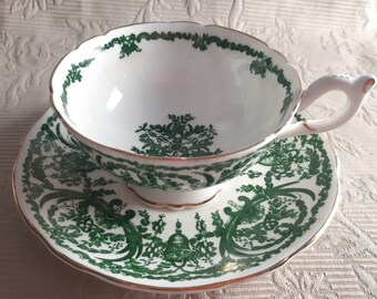 Elaborate Coalport green on white tea duo - hand painted fine detailed hanging flower baskets and radiating design - elegant tea cup