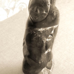 Early Authentic Inuit Sculpture - signed Pete and Inuit disc number 10235 -  Soapstone carving - Inuk hunter with his catch - Inuit