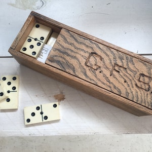 1950s Bakelite dominoes set in oak wood box sliding lid