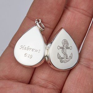 May include: Silver teardrop locket with an engraved anchor on one side and the text "Hebrews 6:19" on the other side.