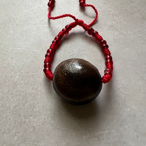 Pulsera roja para baby met ojo de venado