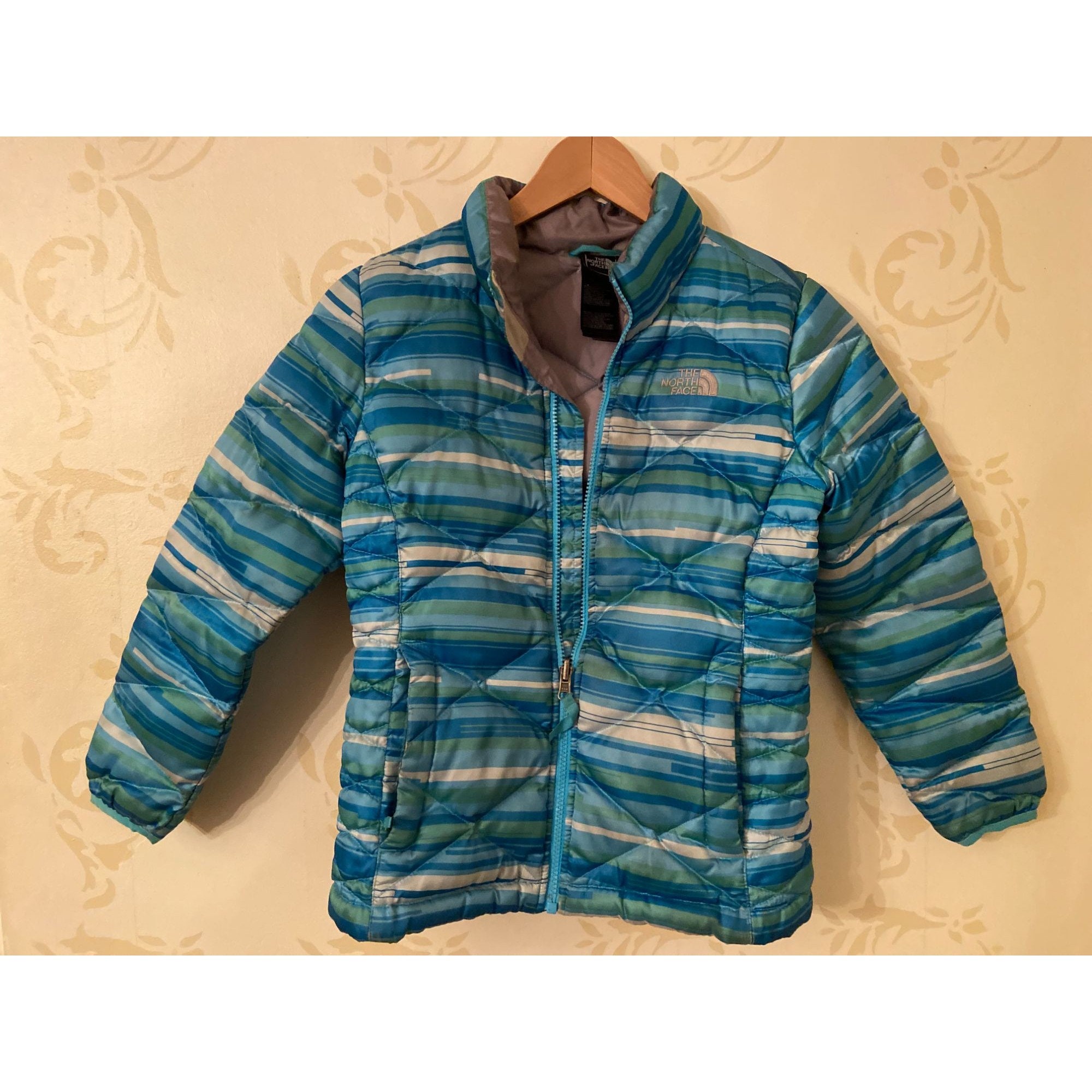 multi coloured north face jacket