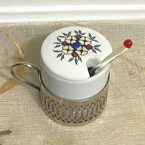 Porcelain vintage condiment pot, 2.25” small, silver plated holder with tiny blown glass spoon, not original, but compliments the set.