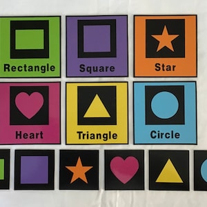 May include: Educational flashcards featuring various shapes: rectangle, square, star, heart, triangle, and circle. Each shape is displayed in a vibrant color against a black background, with the shape's name below.