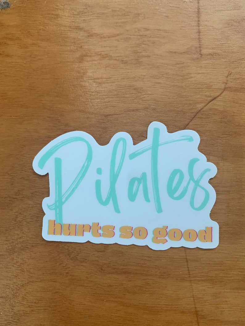 white and teal Pilates sticker that says Pilates hurts so good in a script font 3 x 3 inches