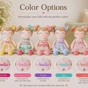 May include: Five personalized dolls with different colored dresses and bows. Each doll has a name embroidered on the dress. The image includes color options: Dark Pink, Bubblegum Pink, Purple, Aqua, and Coral. Text reads: "Color Options. Personalize your doll with the perfect color!"