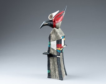 Black bird sitting on the roof ceramic colorful sculpture - ceramic house and bird object