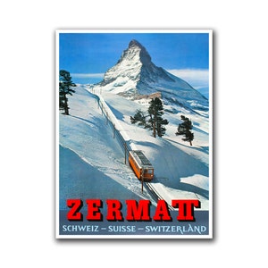 May include: A vintage travel poster featuring a red train travelling up a snowy mountainside towards the Matterhorn peak. The poster reads "Zermatt" in red letters and "Schweiz - Suisse - Switzerland" in black letters.