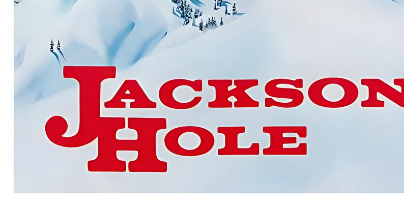 Może przedstawiać: Czerwony tekst na białym tle z napisem "JACKSON HOLE".