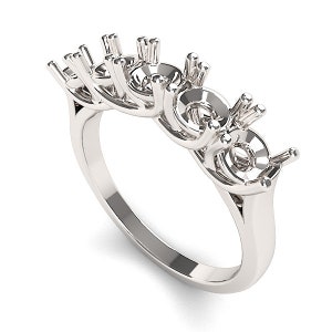 May include: A silver ring setting with four round prongs for stones. The setting is designed to hold four stones in a row.