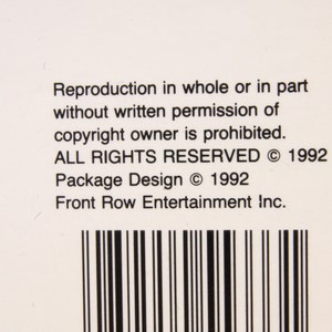 May include: A white label with black text that reads "Reproduction in whole or in part without written permission of copyright owner is prohibited. ALL RIGHTS RESERVED &copy; 1992 Package Design &copy; 1992 Front Row Entertainment Inc."