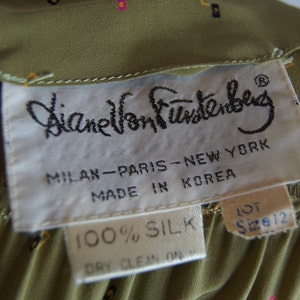 May include: A white tag with black text that reads "Diane Von Furstenberg", "Milan-Paris-New York", "Made in Korea", "100% Silk", and "Lot Size 12".