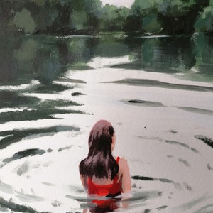 May include: A woman in a red swimsuit stands in a lake, facing away from the viewer. The water is calm and reflects the surrounding trees.