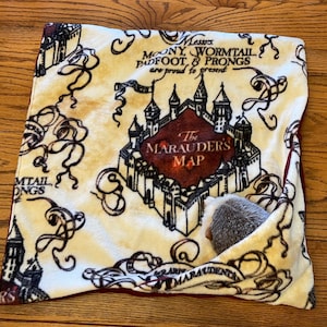 May include: A set of three ceramic mugs with a speckled, matte finish. The mugs are in shades of cream, light gray, and dark gray. Each mug has a simple, minimalist design, perfect for coffee or tea.