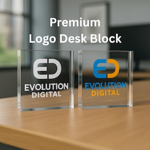 May include: Two clear acrylic desk blocks with the text "Premium Logo Desk Block". Each block features the "ED" logo and "EVOLUTION DIGITAL" text. One logo is white, the other is blue and orange.