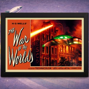 May include: Framed vintage movie poster for "The War of the Worlds." The poster features a retro design with the title in large, stylized text. A spaceship and a ray gun are depicted, with a city in the background. The poster is framed in black.