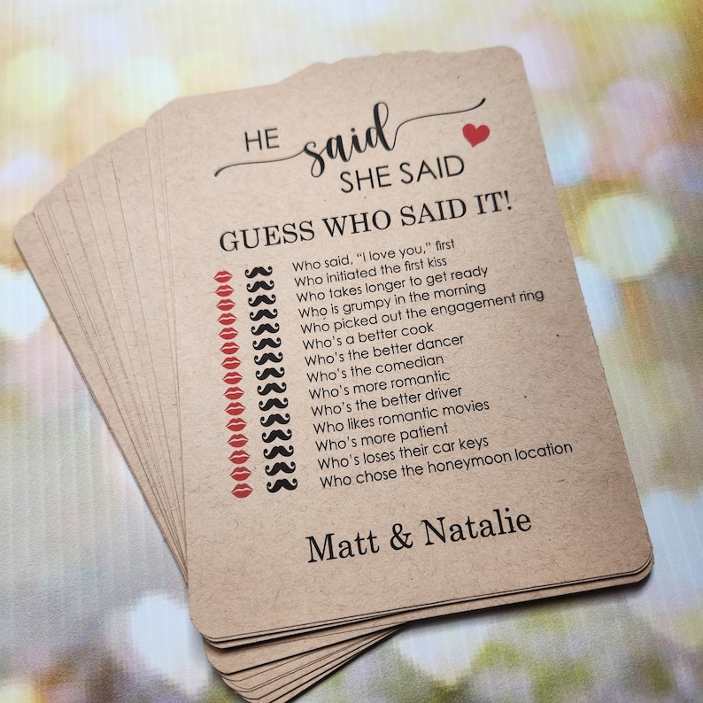 May include: A brown card game with the text "HE said SHE SAID GUESS WHO SAID IT!" and a list of questions about a couple's relationship. The card also includes the names "Matt & Natalie".