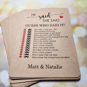 May include: A brown card game with the text "HE said SHE SAID GUESS WHO SAID IT!" and a list of questions about a couple's relationship. The card also has the names "Matt & Natalie" at the bottom.