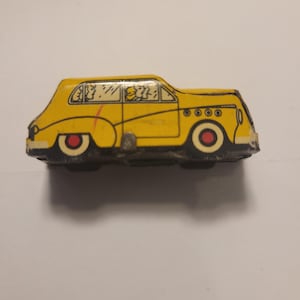 1949 Mot-O-Run Magic Motion - Yellow Sedan Car
