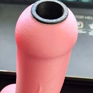 this is a picture of the high-temp plastic insert, which adds to the heat resistance of the handles inner core. without this insert, this color is prone to warping.