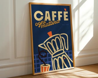 May include: A framed art print with a navy blue background featuring a gold-colored illustration of a coffee maker and a cup. The words "CAFFE ogni mattina" are in gold lettering. The print is in a wooden frame.