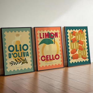May include: Three framed art prints with Italian food themes. The prints feature illustrations of olive oil, lemons, and tomatoes, with text in Italian. Each print has a black frame and a postage stamp design.