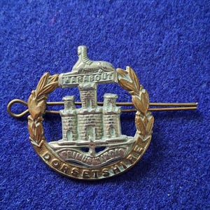 Das originale Kappenabzeichen des Dorsetshire Lineal, WWI - WWII