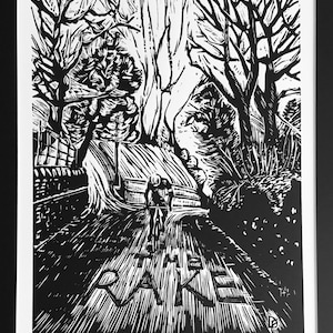 May include: Black and white woodcut print of a cyclist riding up a hill with trees on either side. The text "The Rake" is printed on the road in front of the cyclist. The print is numbered 1/50 and signed "D.L.T.C.O.L.I."