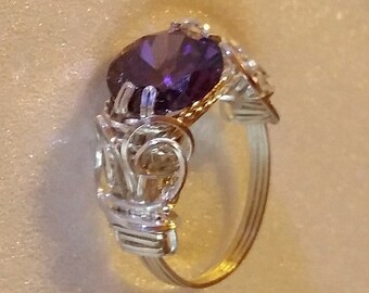 FEBRUARY BIRTHSTONE,  Natural Amethyst, 10mm round cut stone wrapped in sterling silver solitaire mount.  Size 7