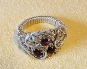 Sterling filligree ring with gorgeous rich red natural garnets, JANUARY BIRTHSTONE. Wraped on a sturdy forged band. Size 7