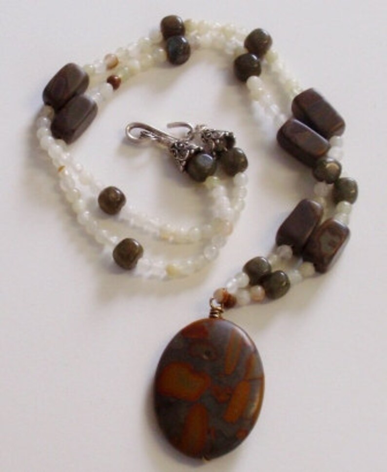 Natural stone focal on beaded necklace. Beautiful browns with creamy ivory toned beads. Silver clasp. image 1
