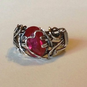 Beautiful Lab created ruby, 12x8mm, is wrapped in sterling silver with antique patina. Prong setting has heart motif in silver. Size 9 1/2 image 2